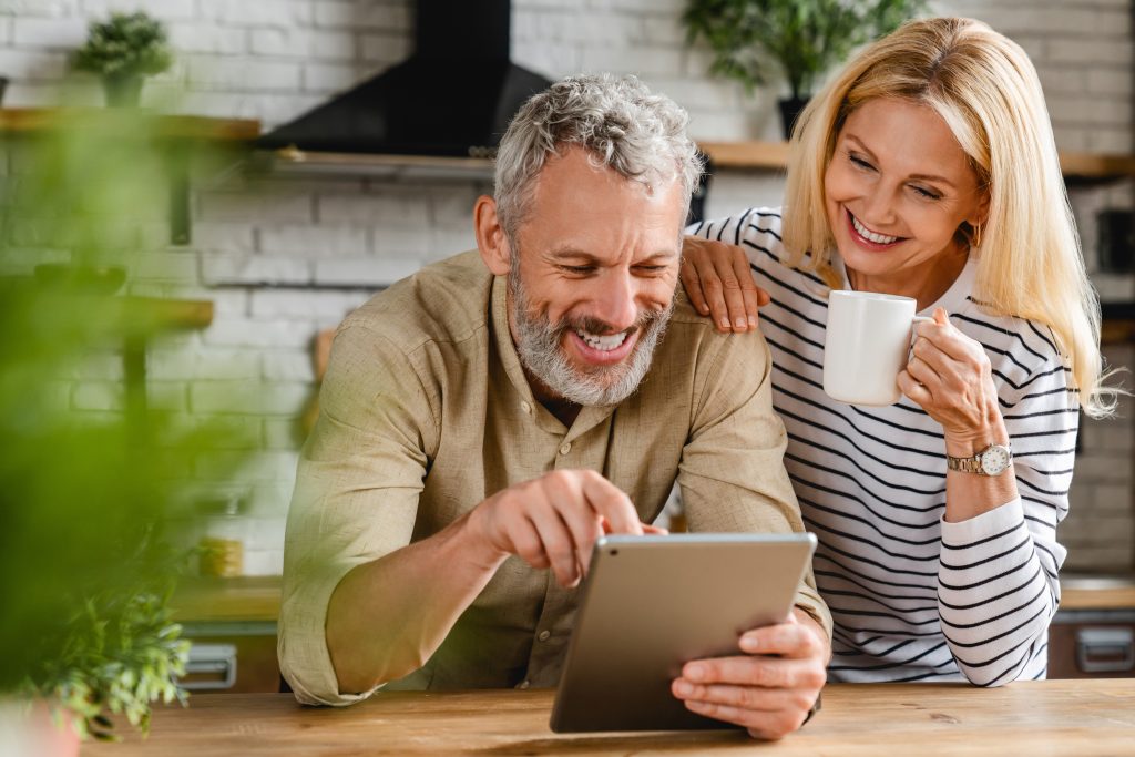 Senior couple looking at a tablet